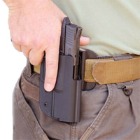 Good training and the right holster and belt make it easy to draw and reholster a handgun.